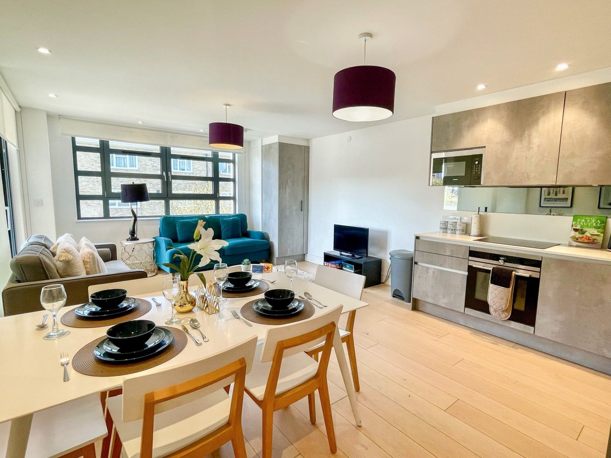 Open-plan kitchen, dining table and sitting area